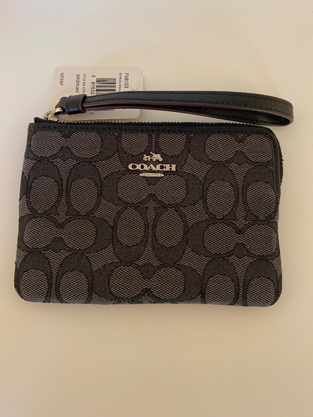 Coach Signature Corner Zip Wristlet in black and black smoke jacquard (NWT)
